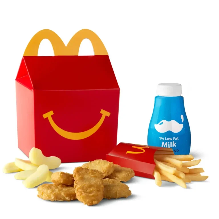 A 6 Piece Chicken McNuggets® Happy Meal® paired with fries, apple slices, and a drink for a larger meal.