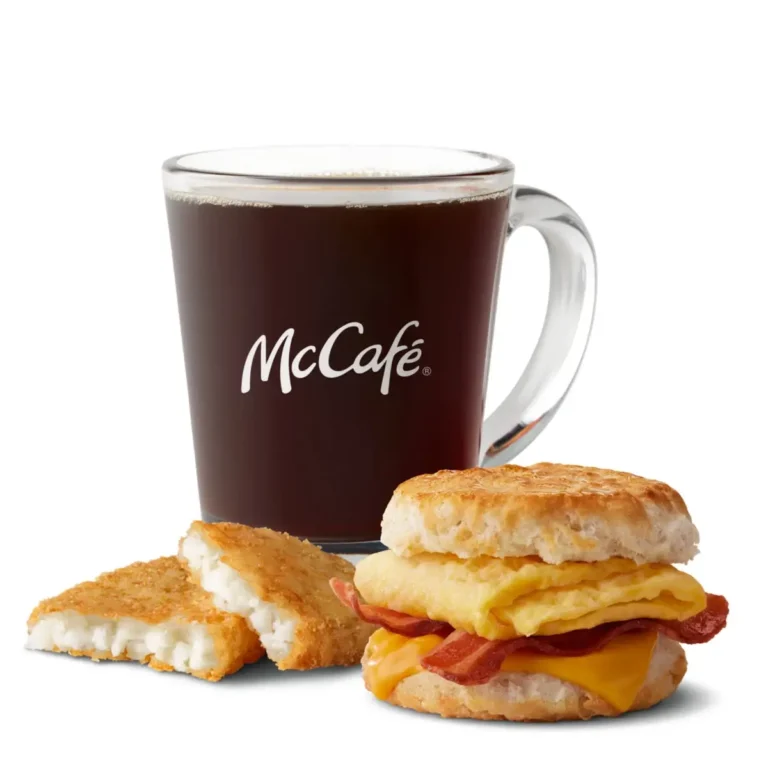 A Bacon, Egg & Cheese Biscuit served with crispy hash browns and a drink for a fulfilling breakfast.