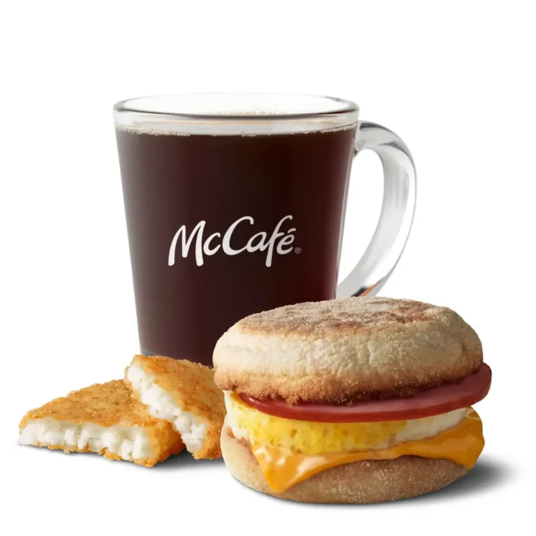 An Egg McMuffin® sandwich served with crispy hash browns and a drink for a complete breakfast.