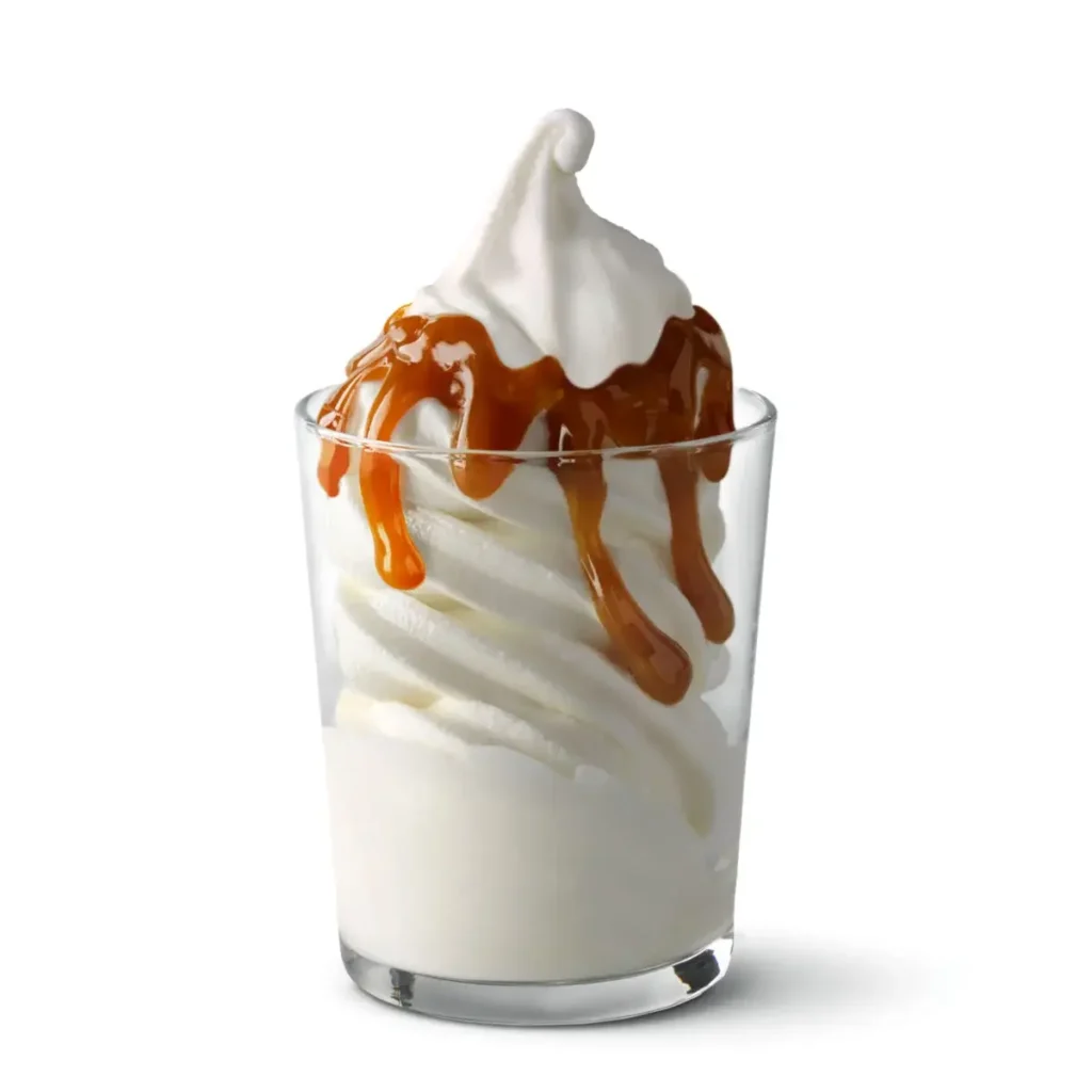 A McDonald's Hot Caramel Sundae with creamy vanilla soft-serve topped with warm, rich caramel sauce.