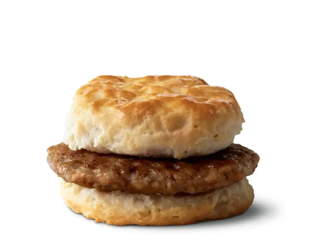 A soft, flaky biscuit paired with a savory sausage patty for a classic breakfast option.