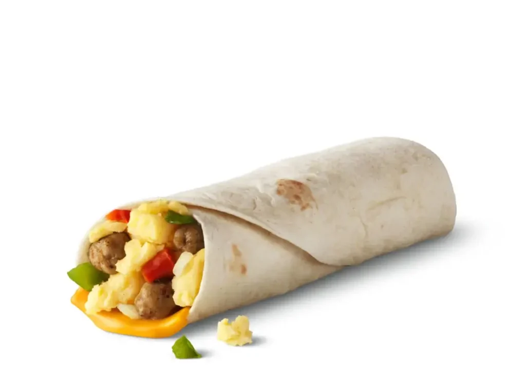 A soft tortilla filled with scrambled eggs, sausage, cheese, and peppers for a quick breakfast option