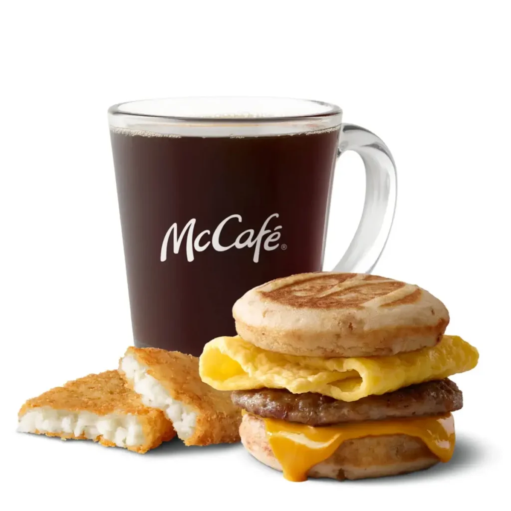 A Sausage, Egg & Cheese McGriddles® paired with crispy hash browns and a drink for a complete breakfast.